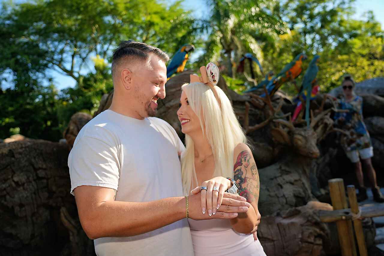 Krystal and Joseph looking at each other with ring on hand